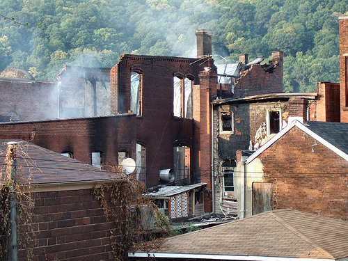 Rear view of two buildings damaged by the fire taken from Chess St. looking north.