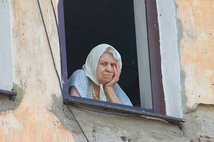 woman at window watching