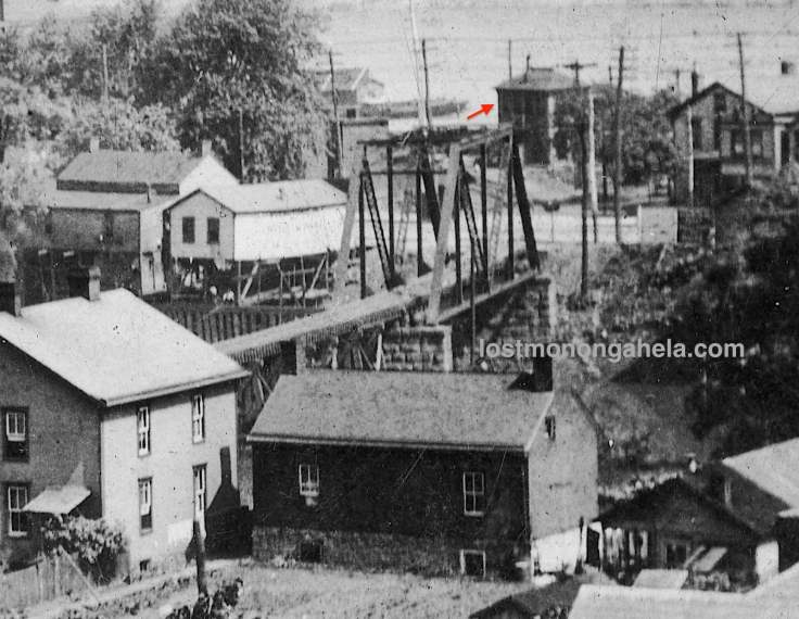 Ellsworth Secondary railroad bridge pointing to the mystery building. (Detail of postcard postmarked 1909)